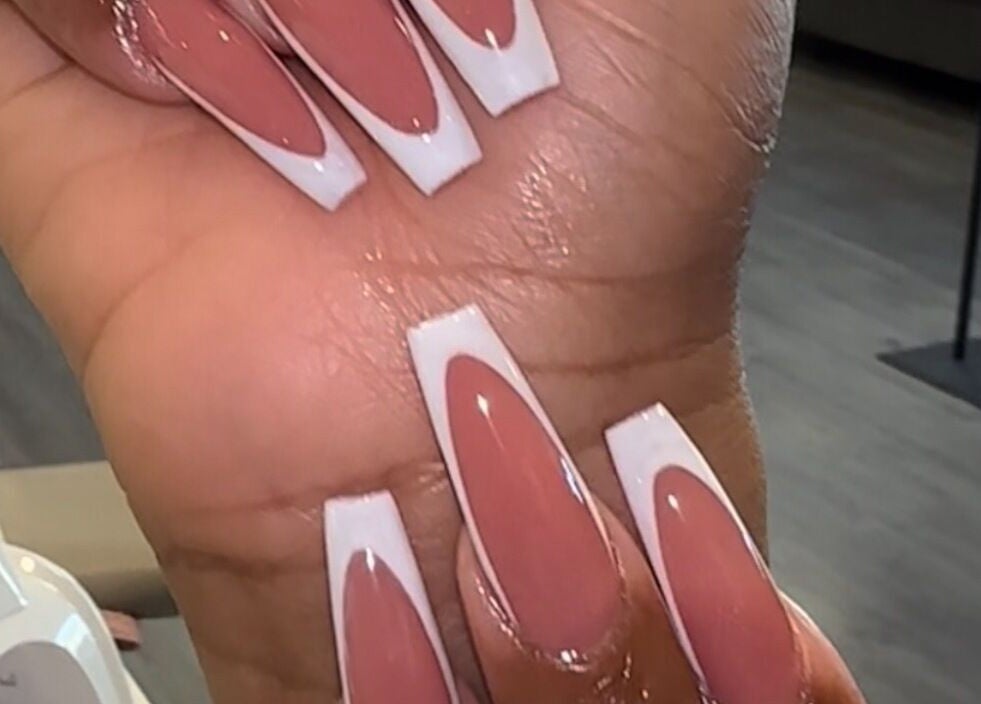 Close-up of pink and white nail art from D’yVonne’s Nails and Beauty Bar in Forest Park, Georgia, US.