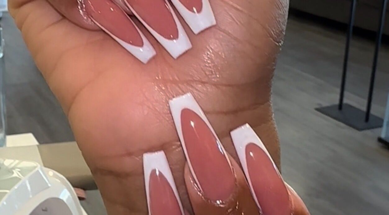 Close-up of pink and white nail art from D’yVonne’s Nails and Beauty Bar in Forest Park, Georgia, US.