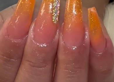 Glittering sunset nails at D’yVonne’s Nails and Beauty Bar, Forest Park, Georgia, US. Stylish nail art design.