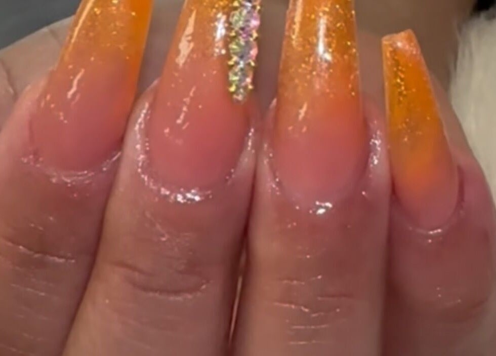 Glittering sunset nails at D’yVonne’s Nails and Beauty Bar, Forest Park, Georgia, US. Stylish nail art design.