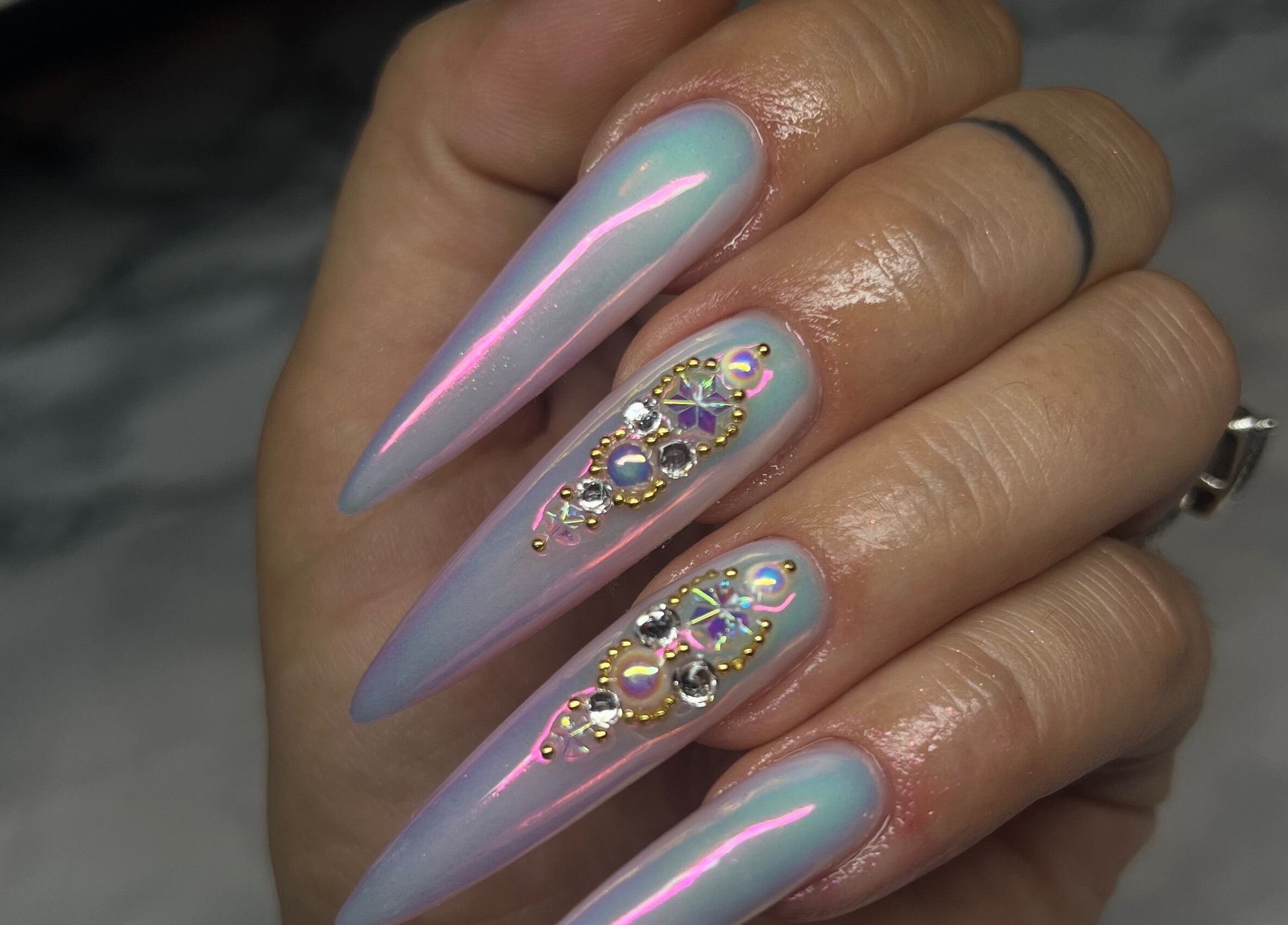 Elegant shimmering nail art with gems at Gatz Beauty Vision, Wellingborough, England, GB.