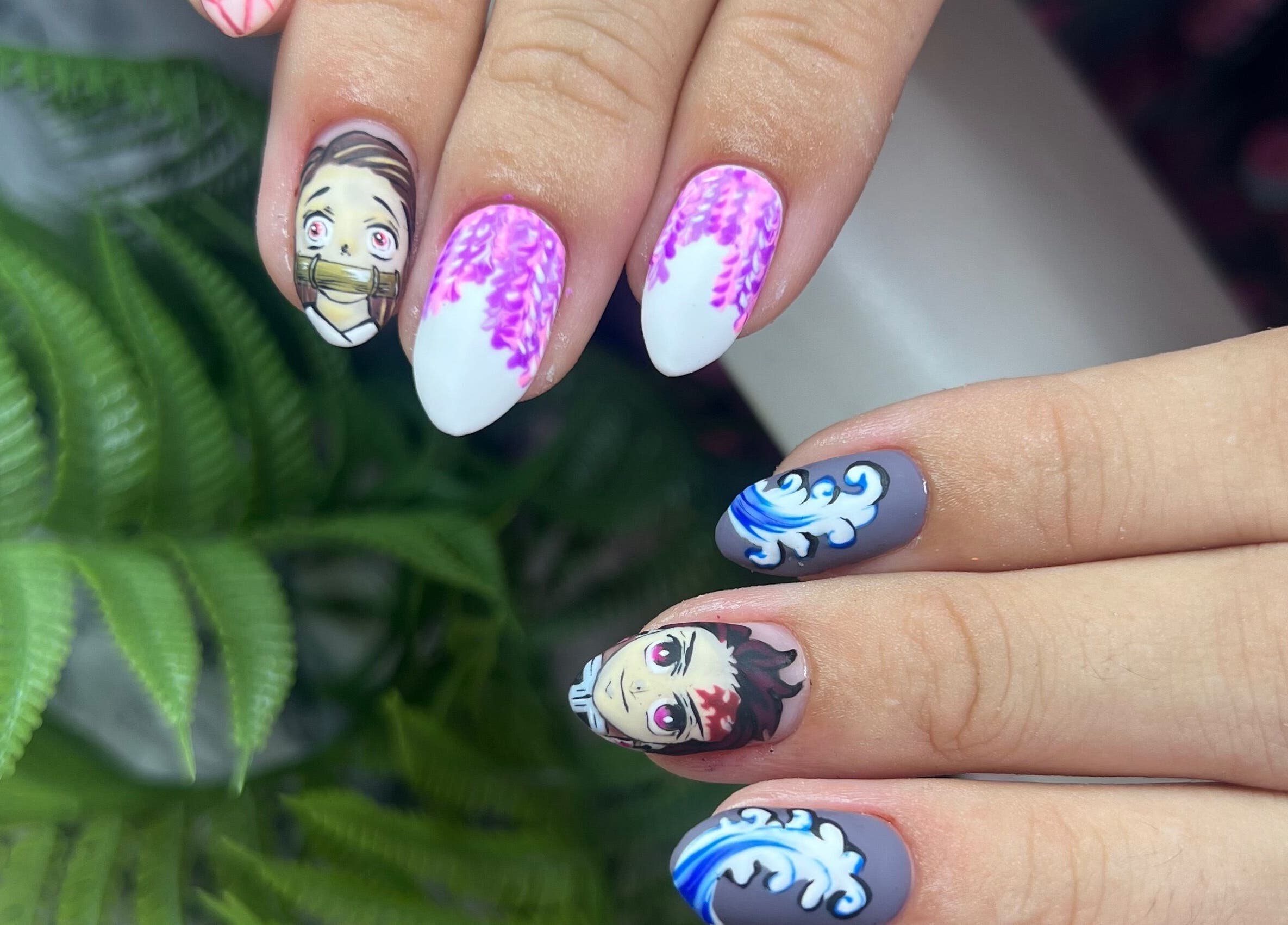 Anime-themed nail art at Gatz Beauty Vision, Wellingborough, England, GB. Vibrant designs with character details.
