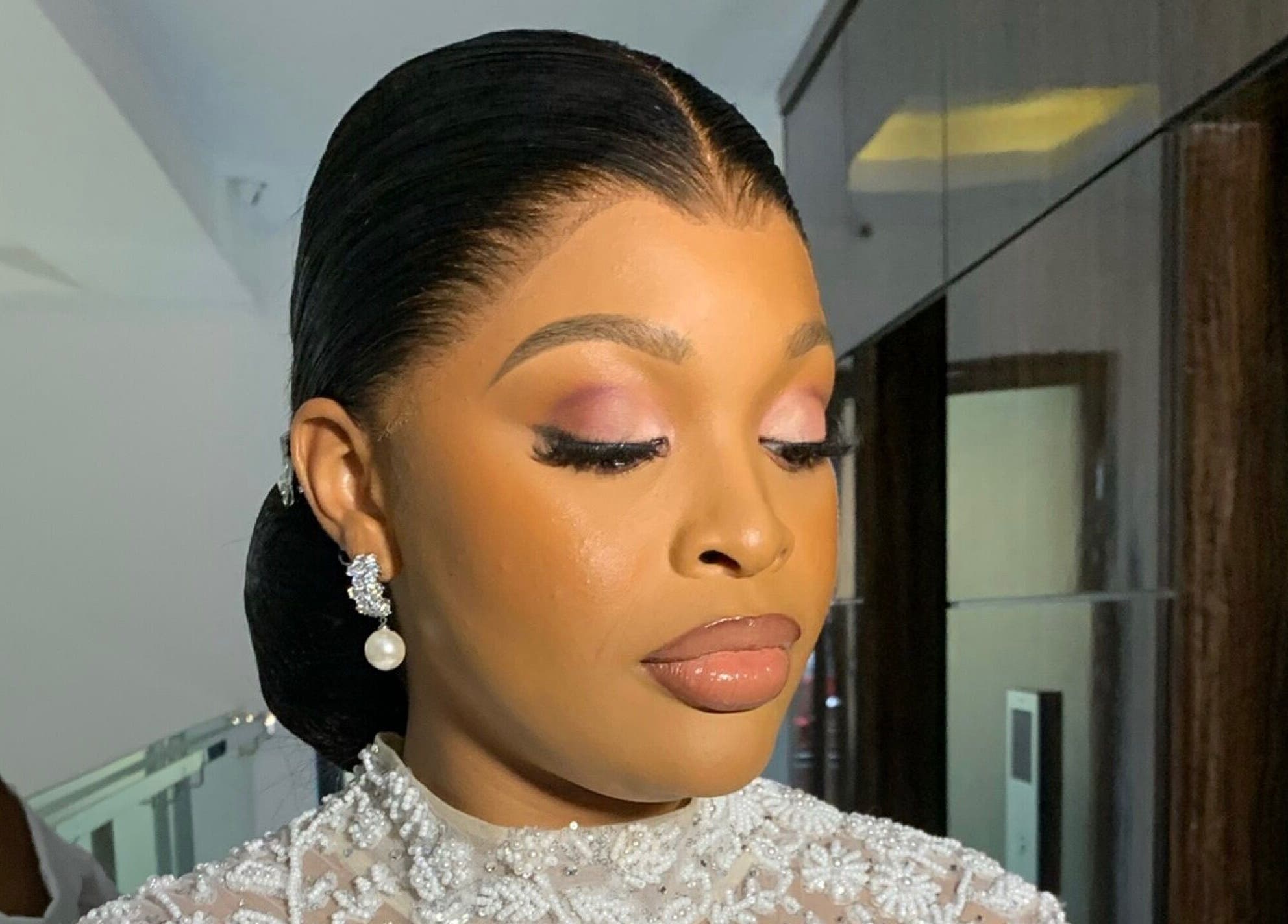 Elegant makeup and hairstyle at SOARS Artistry, Abuja, Federal Capital Territory, NG.