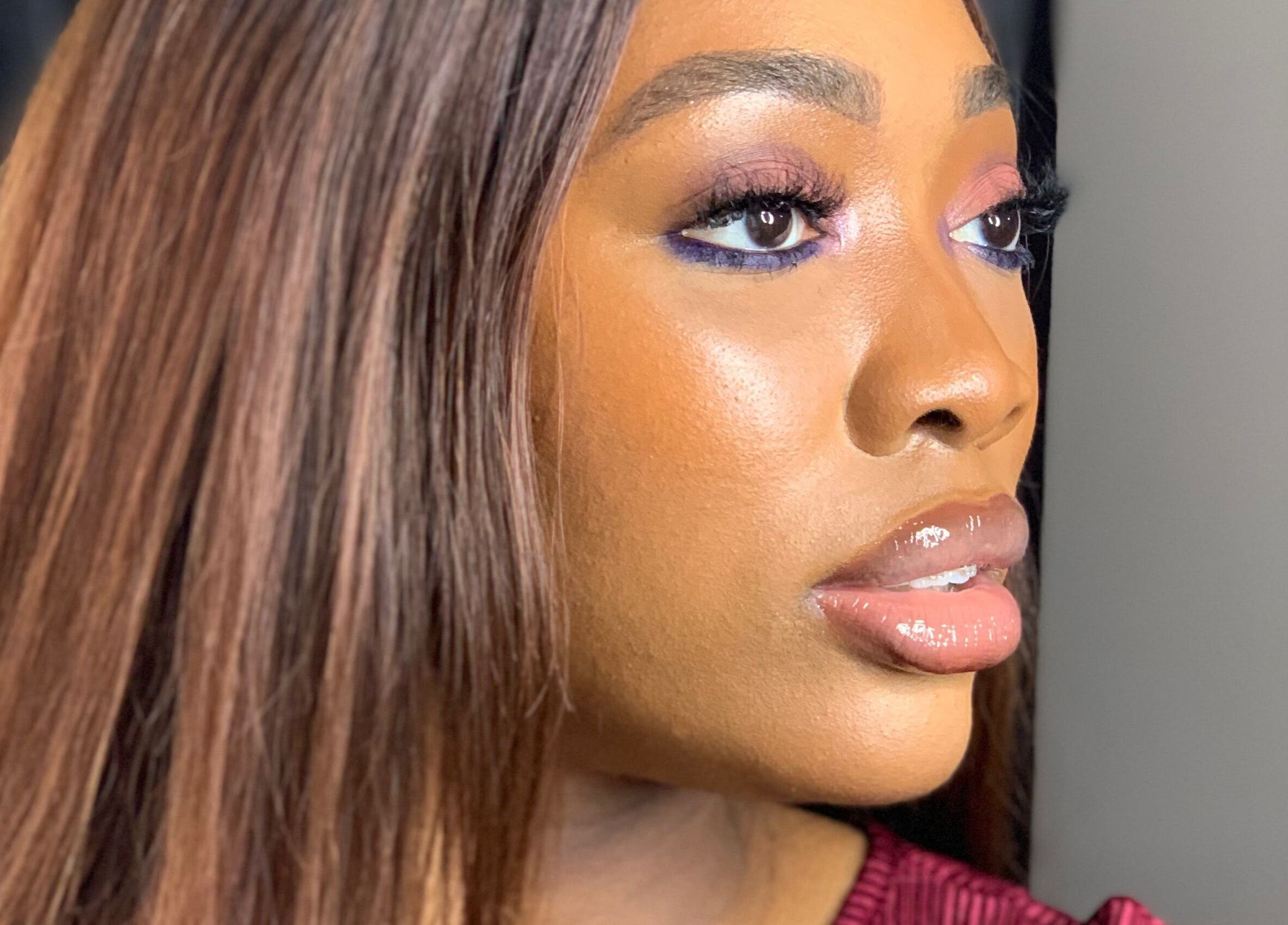 Close-up of a woman with elegant makeup at SOARS Artistry, Abuja, Federal Capital Territory, NG.