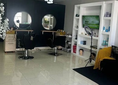 Interior view of Celeniabeautysalon, Philipsburg, Sint Maarten, SX featuring chic styling stations and decor.