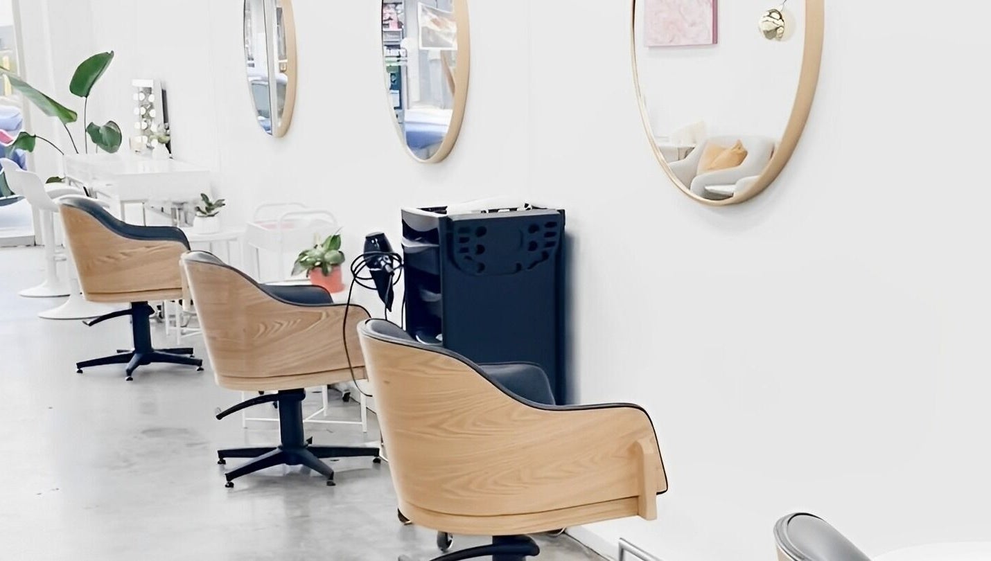 Chic interior of Salon Share Richmond in Richmond, Victoria, AU showcasing stylish chairs and mirrors.