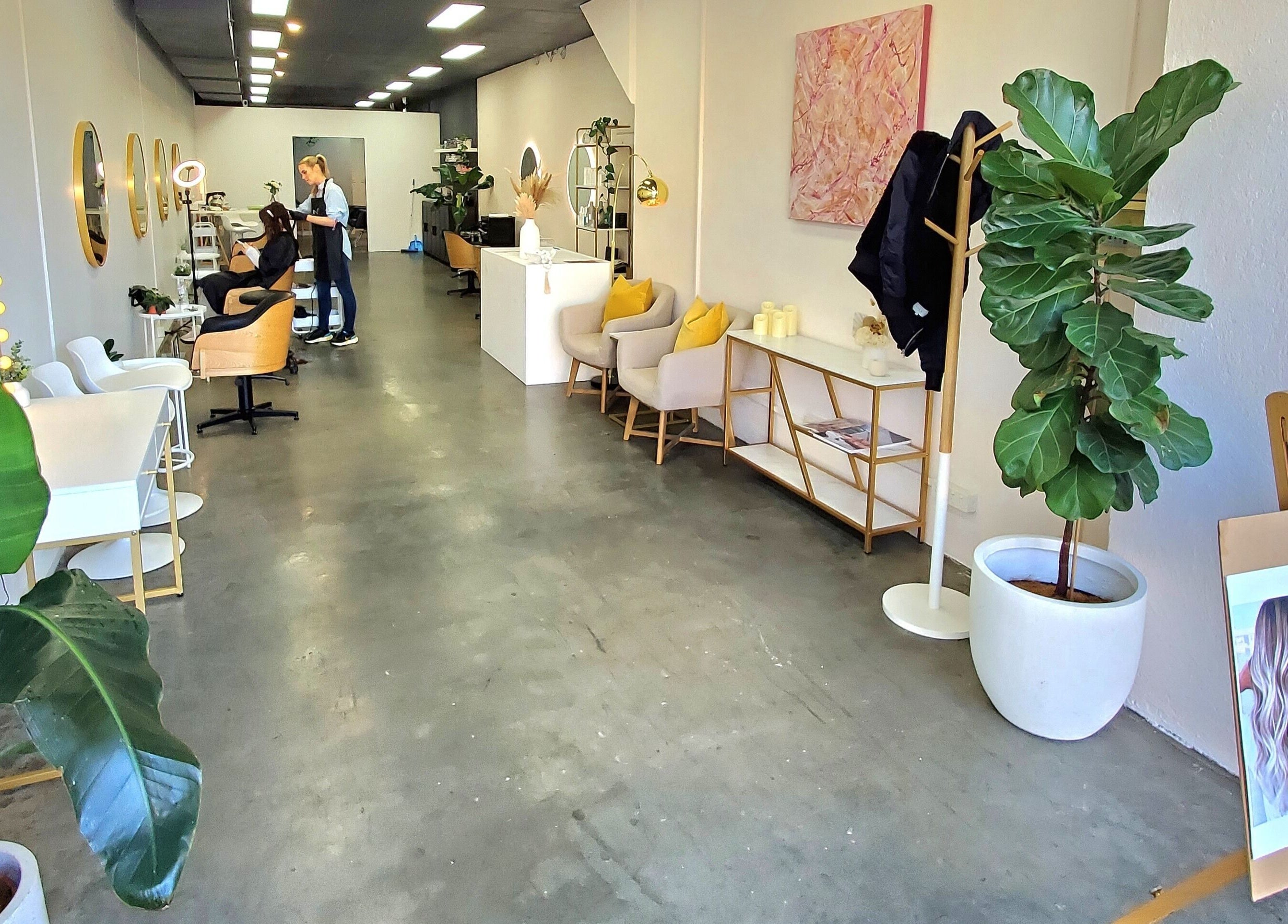 Modern interior of Salon Share Richmond, located in Richmond, Victoria, AU, featuring stylish seating and decor.