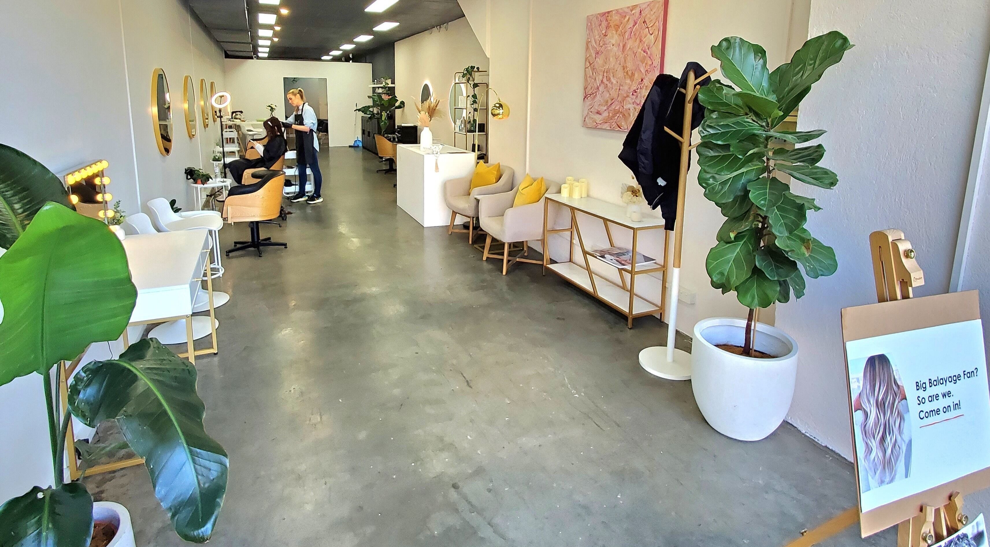 Modern interior of Salon Share Richmond, located in Richmond, Victoria, AU, featuring stylish seating and decor.