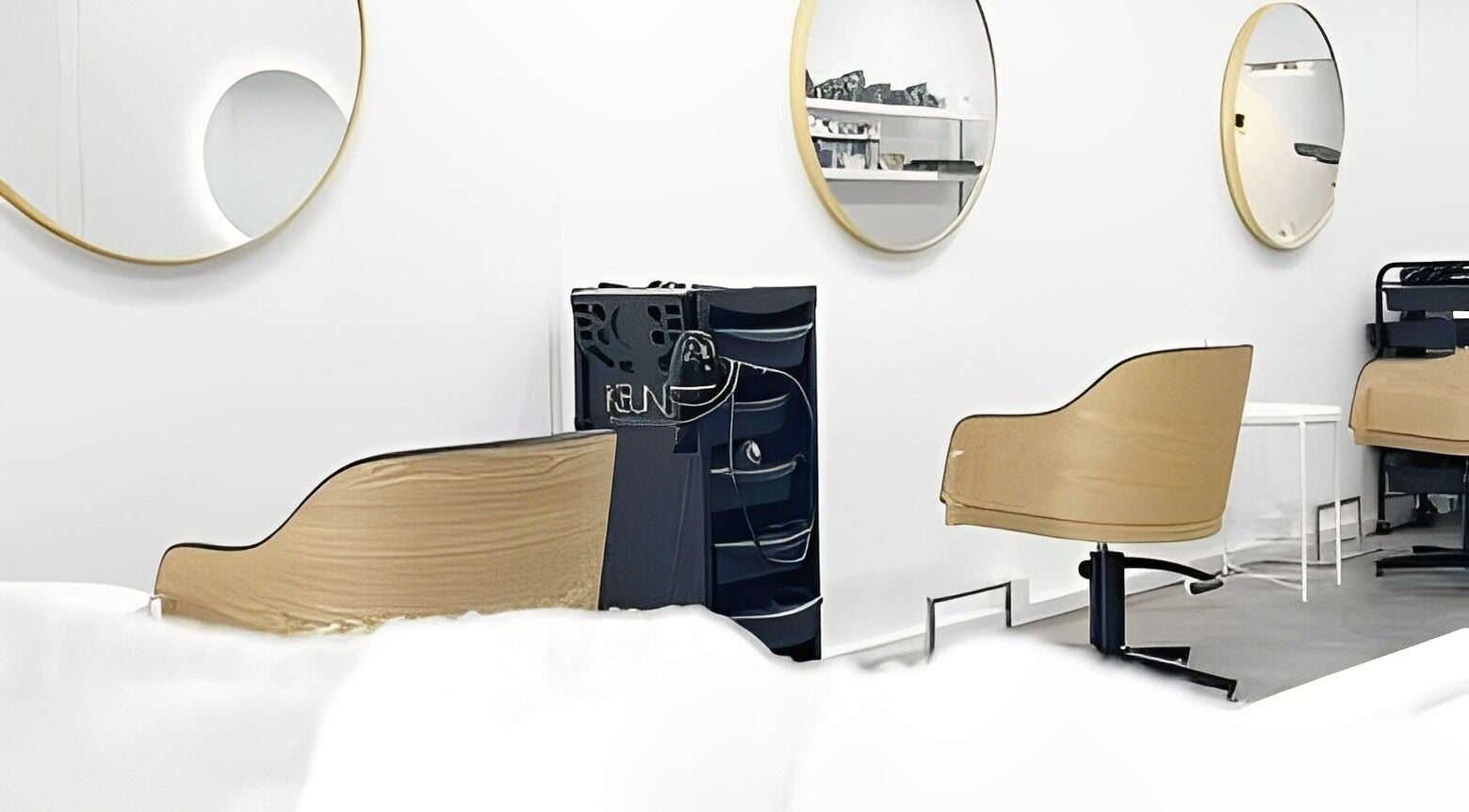 Modern salon interior at Salon Share Richmond in Richmond, Victoria, AU, featuring sleek styling chairs and mirrors.