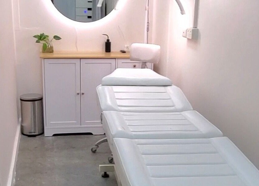 Relaxing treatment room at Salon Share Richmond in Richmond, Victoria, AU with a white therapy bed and minimalist decor.