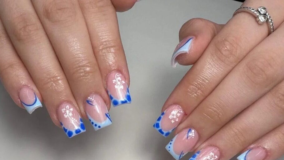 Elegant blue and white nail art design at Kirsty_Koutoure_ in Portsmouth, England, GB.