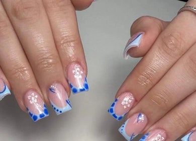 Elegant blue and white nail art design at Kirsty_Koutoure_ in Portsmouth, England, GB.