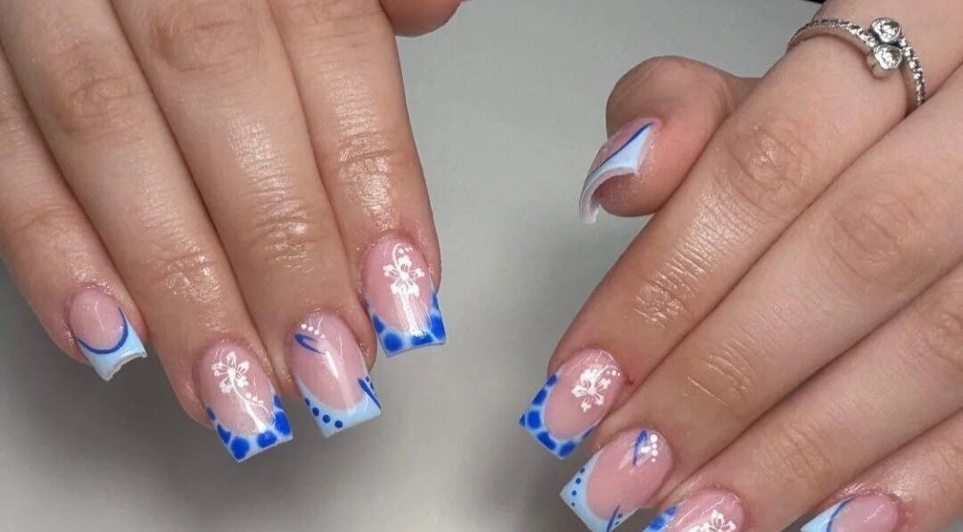 Elegant blue and white nail art design at Kirsty_Koutoure_ in Portsmouth, England, GB.