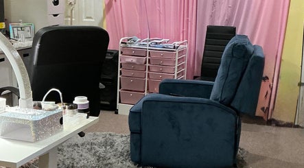 Relaxing beauty nook at Toxica Beauty Bar, Aurora, Illinois, US with cozy seating and organized pink storage.