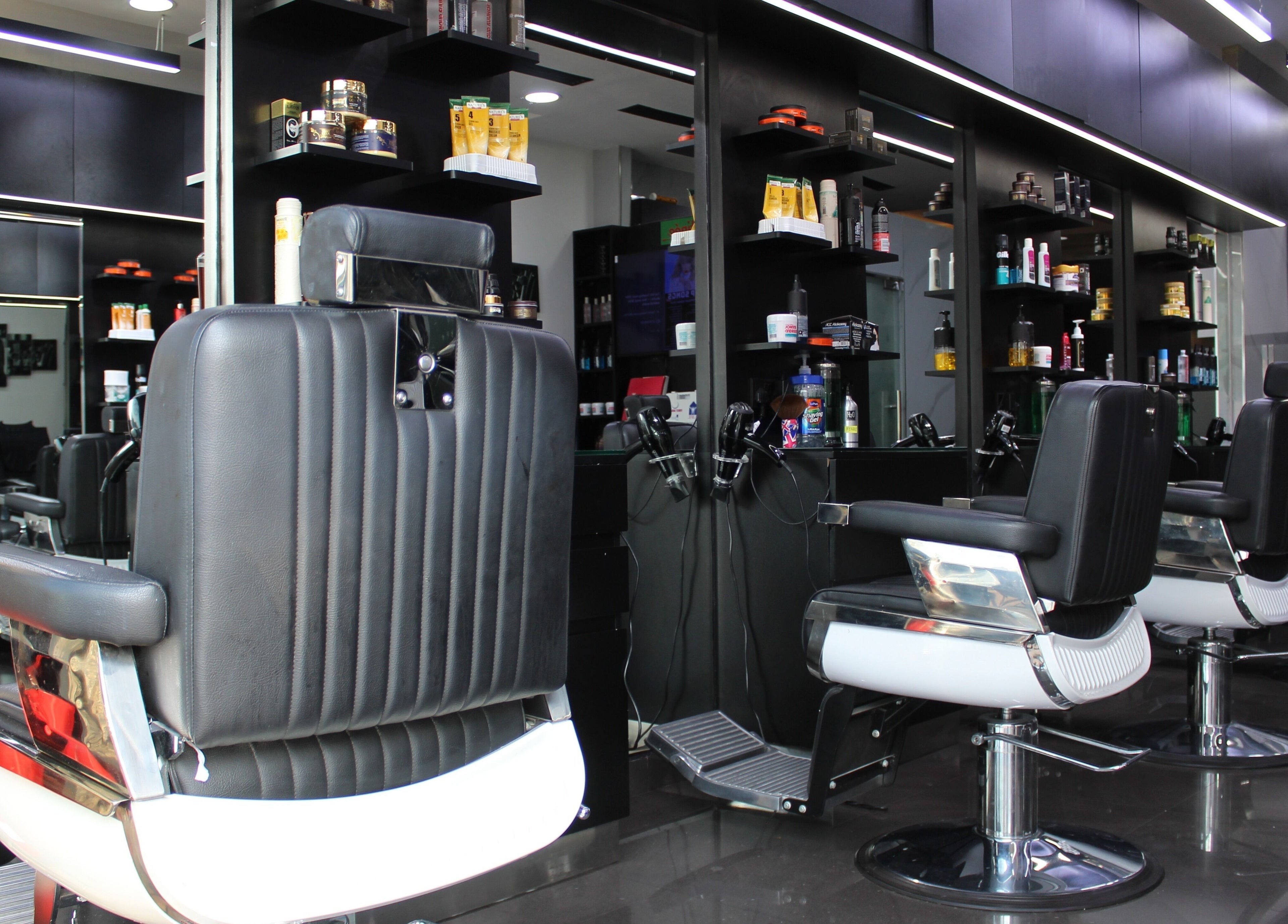 Modern barber chairs at Matinee Gents Salon, Dubai, AE showcasing sleek design and comfort.