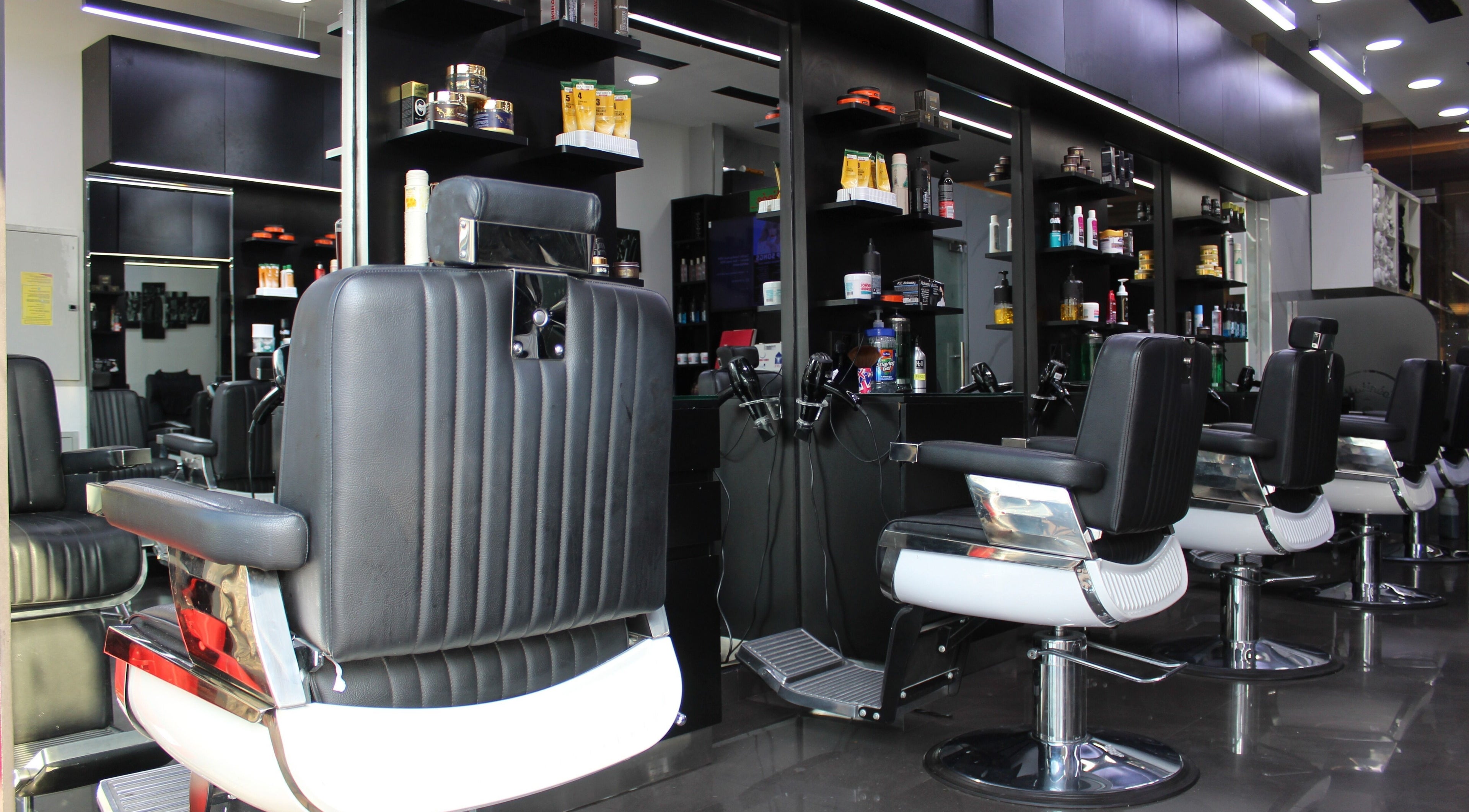 Modern barber chairs at Matinee Gents Salon, Dubai, AE showcasing sleek design and comfort.