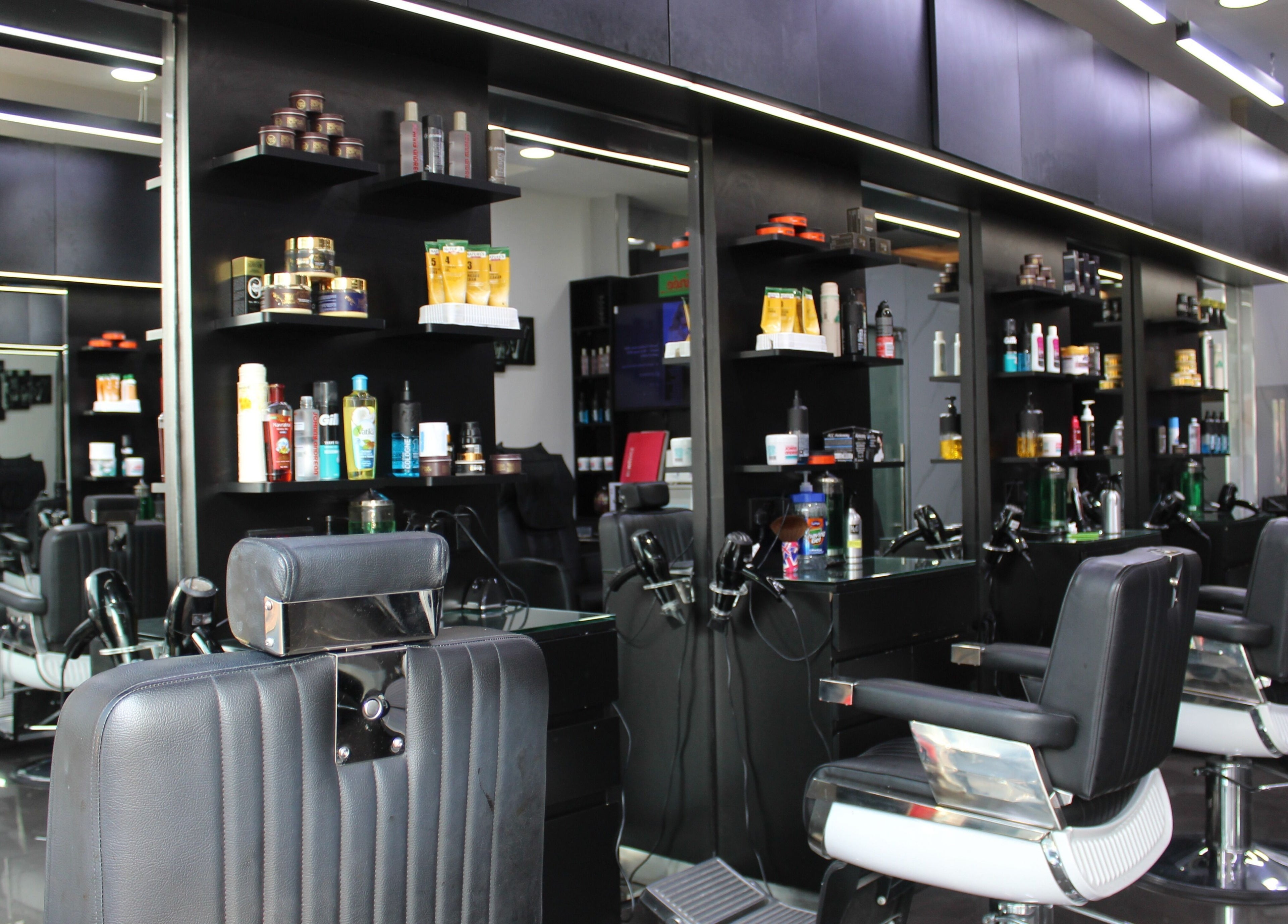 Modern barber chairs and products at Matinee Gents Salon, Dubai, AE show a stylish, welcoming environment.