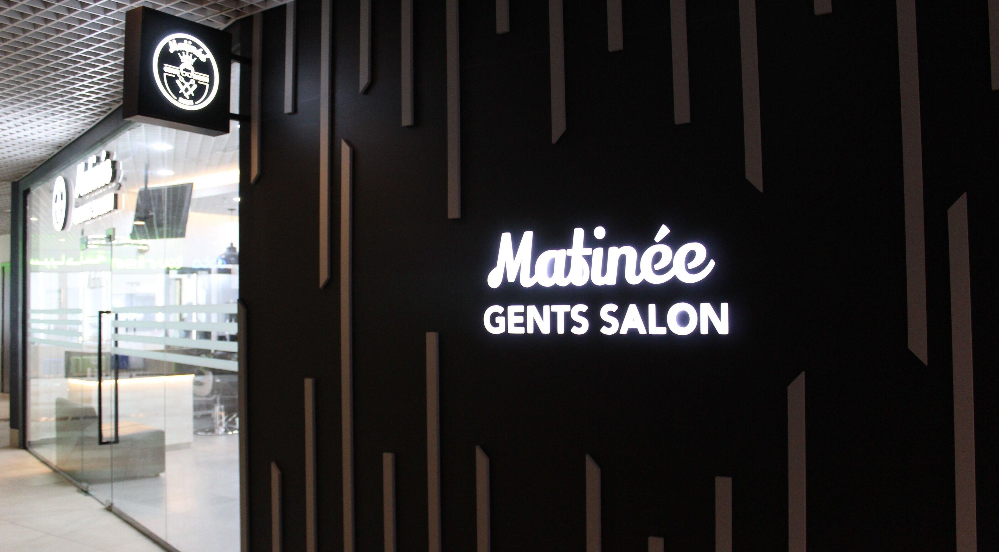 Entrance of Matinee Gents Salon One Deira Mall in Dubai, Dubai, AE with illuminated signage.