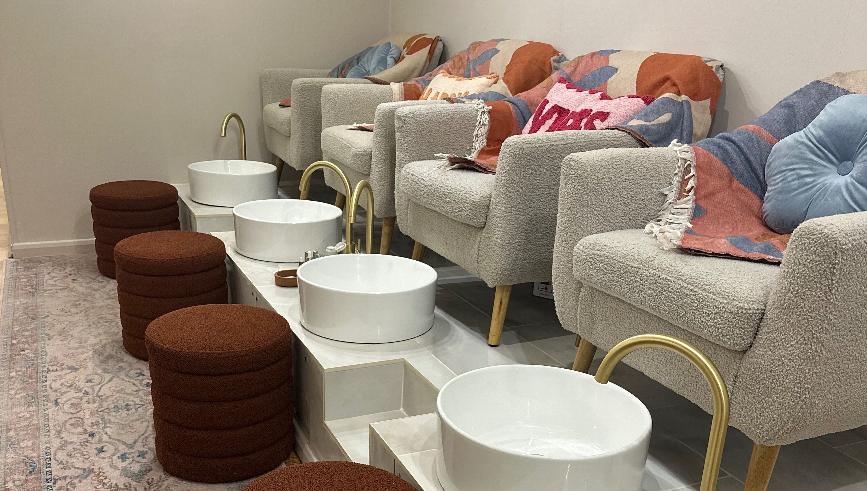 Plush pedicure chairs and basins at Trio Worcester, Worcester, England, GB offering luxurious spa services.