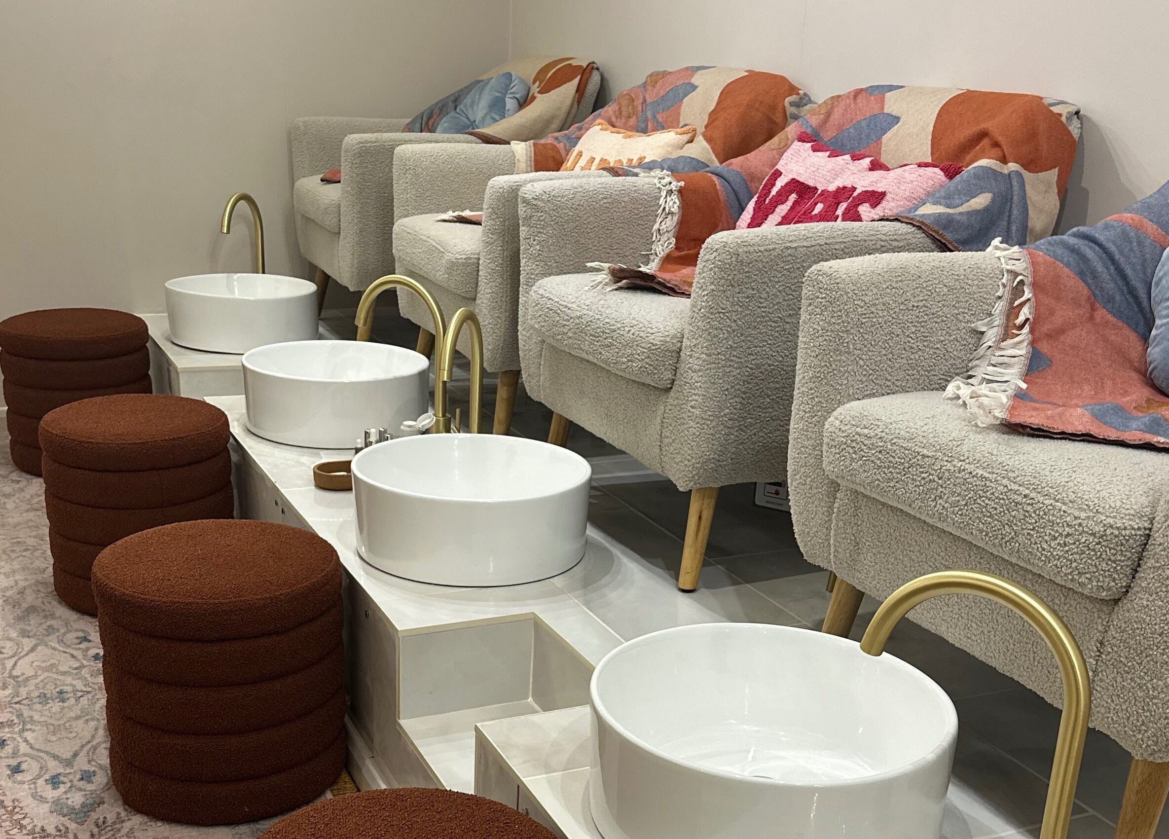 Plush pedicure chairs and basins at Trio Worcester, Worcester, England, GB offering luxurious spa services.
