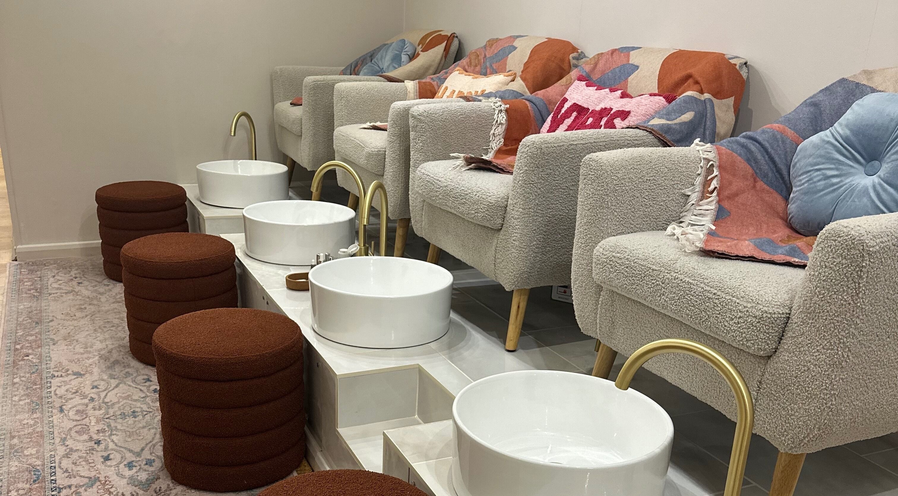 Plush pedicure chairs and basins at Trio Worcester, Worcester, England, GB offering luxurious spa services.