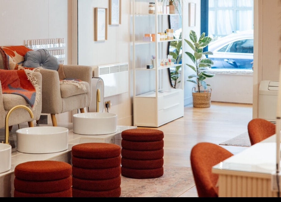 Relaxing seating area at Trio Worcester, Worcester, England, GB, featuring plush chairs and pedicure stations.