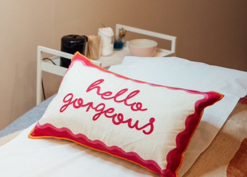 Relaxing massage table with 'hello gorgeous' pillow at Trio Worcester, Worcester, England, GB.