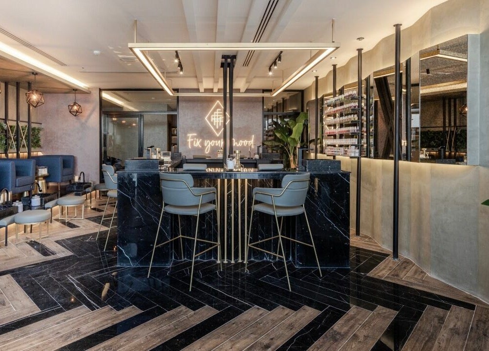 Chic interior of Fix Nails Spa and Salon in Al Khobar, Eastern Province, SA, featuring stylish seating and decor.