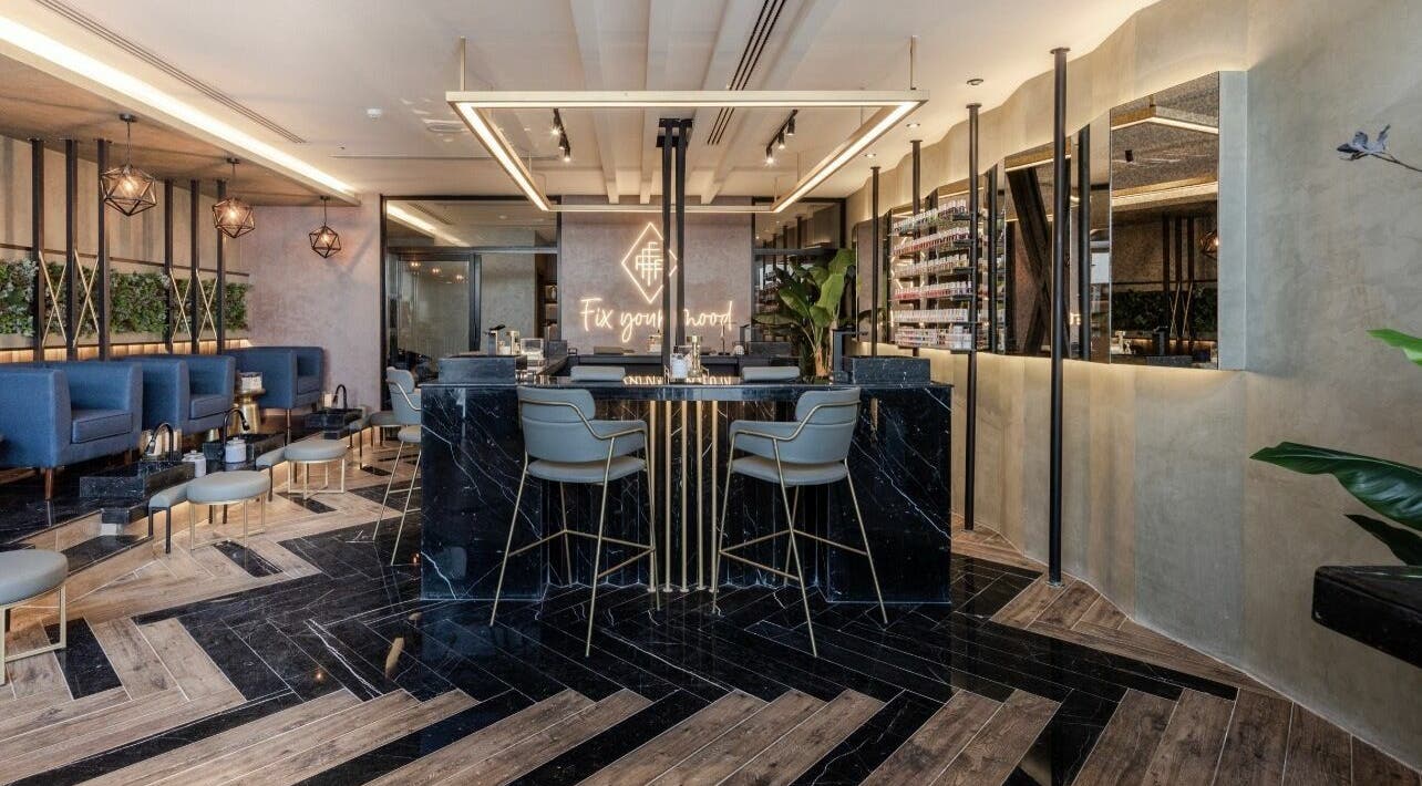 Chic interior of Fix Nails Spa and Salon in Al Khobar, Eastern Province, SA, featuring stylish seating and decor.