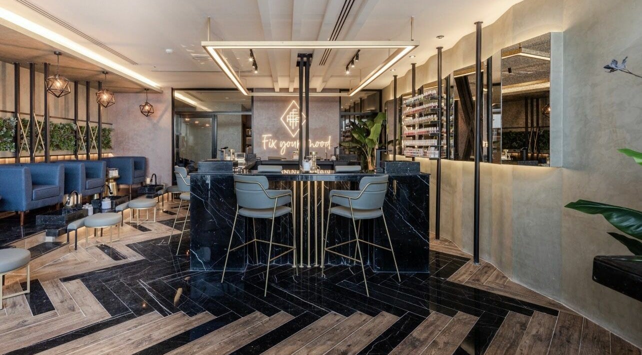 Chic interior of Fix Nails Spa and Salon in Al Khobar, Eastern Province, SA, featuring stylish seating and decor.