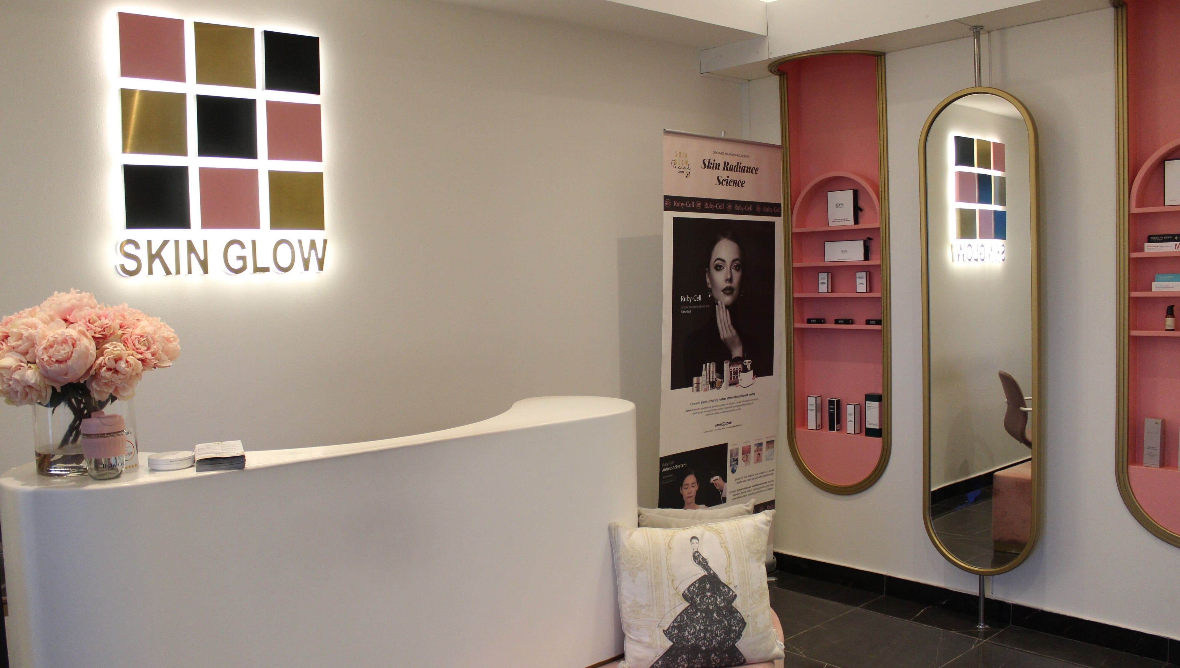 Elegant reception at Skin Glow Facial Center, Abu Dhabi, AE, featuring pink decor and modern design.