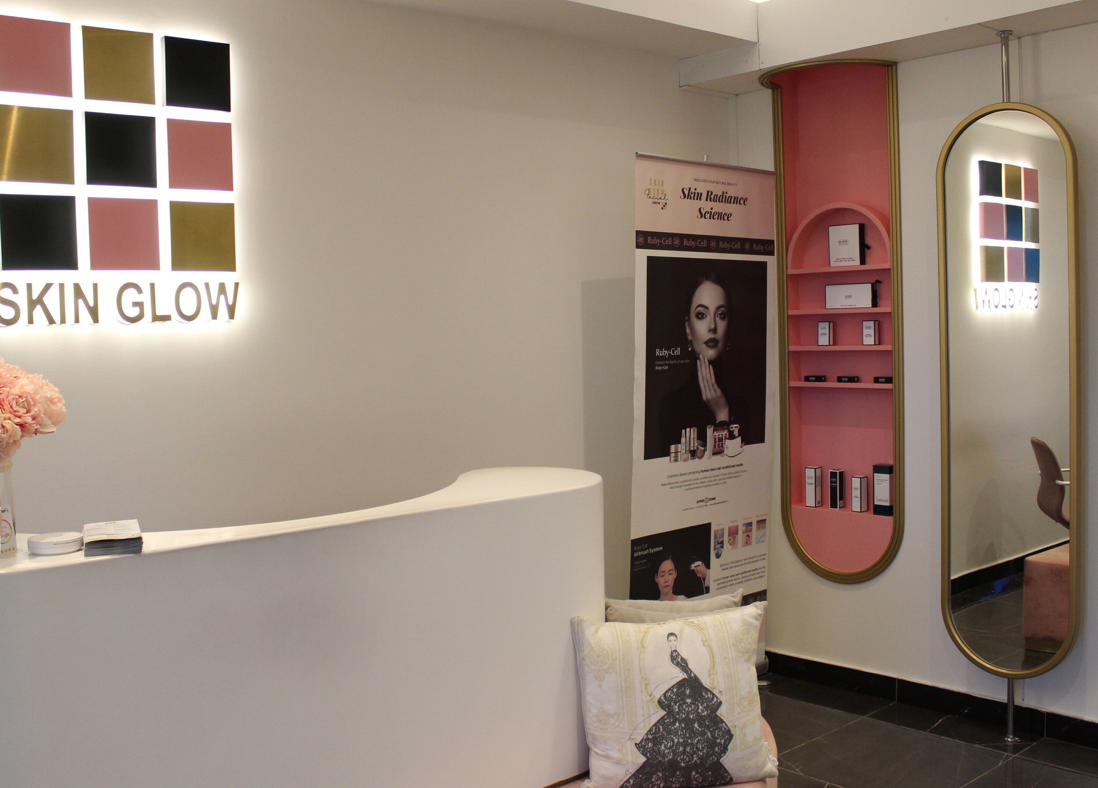 Elegant reception at Skin Glow Facial Center, Abu Dhabi, AE, featuring pink decor and modern design.