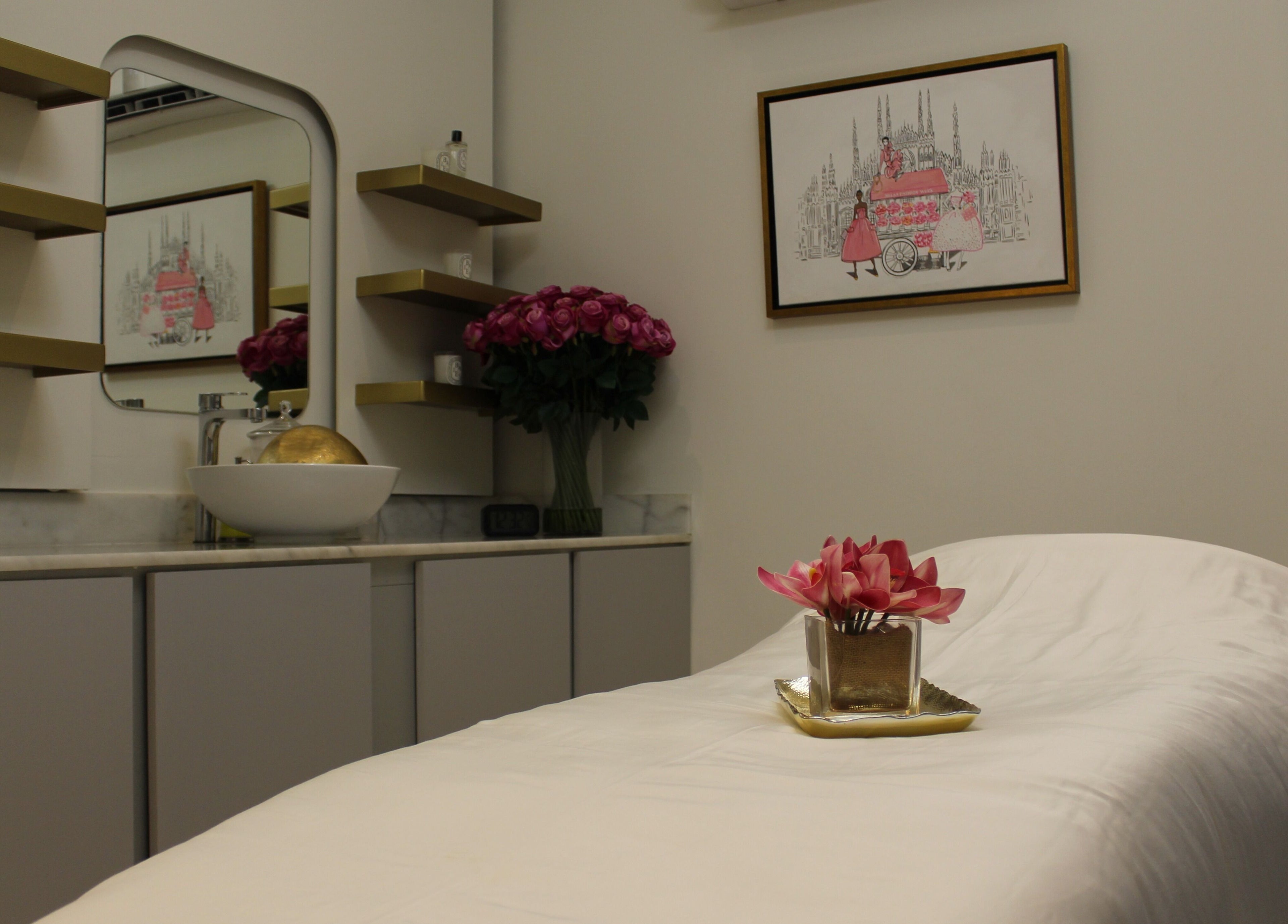 Cozy treatment room at Skin Glow Facial Center in Abu Dhabi, AE, featuring elegant decor and a plush massage bed.