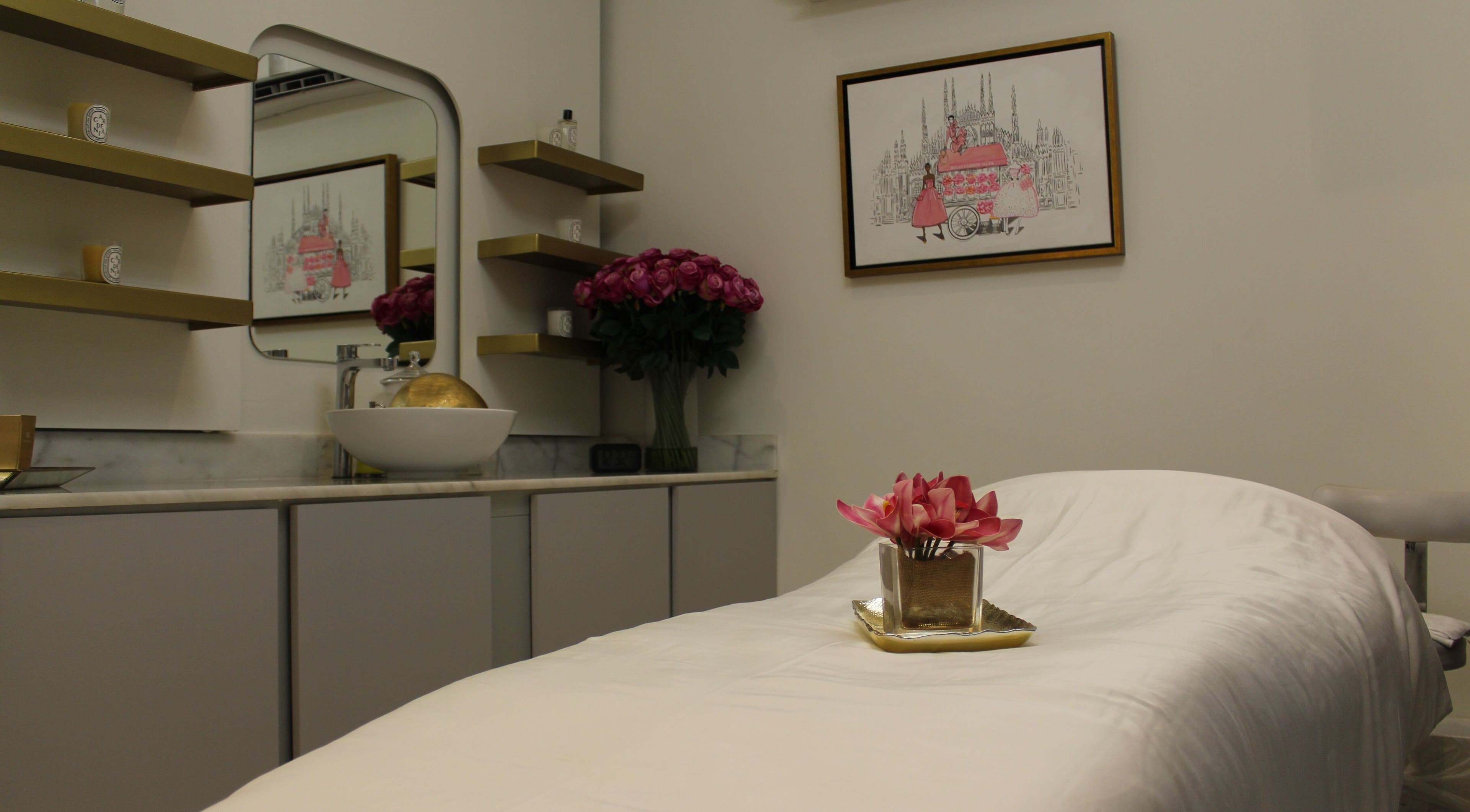 Cozy treatment room at Skin Glow Facial Center in Abu Dhabi, AE, featuring elegant decor and a plush massage bed.