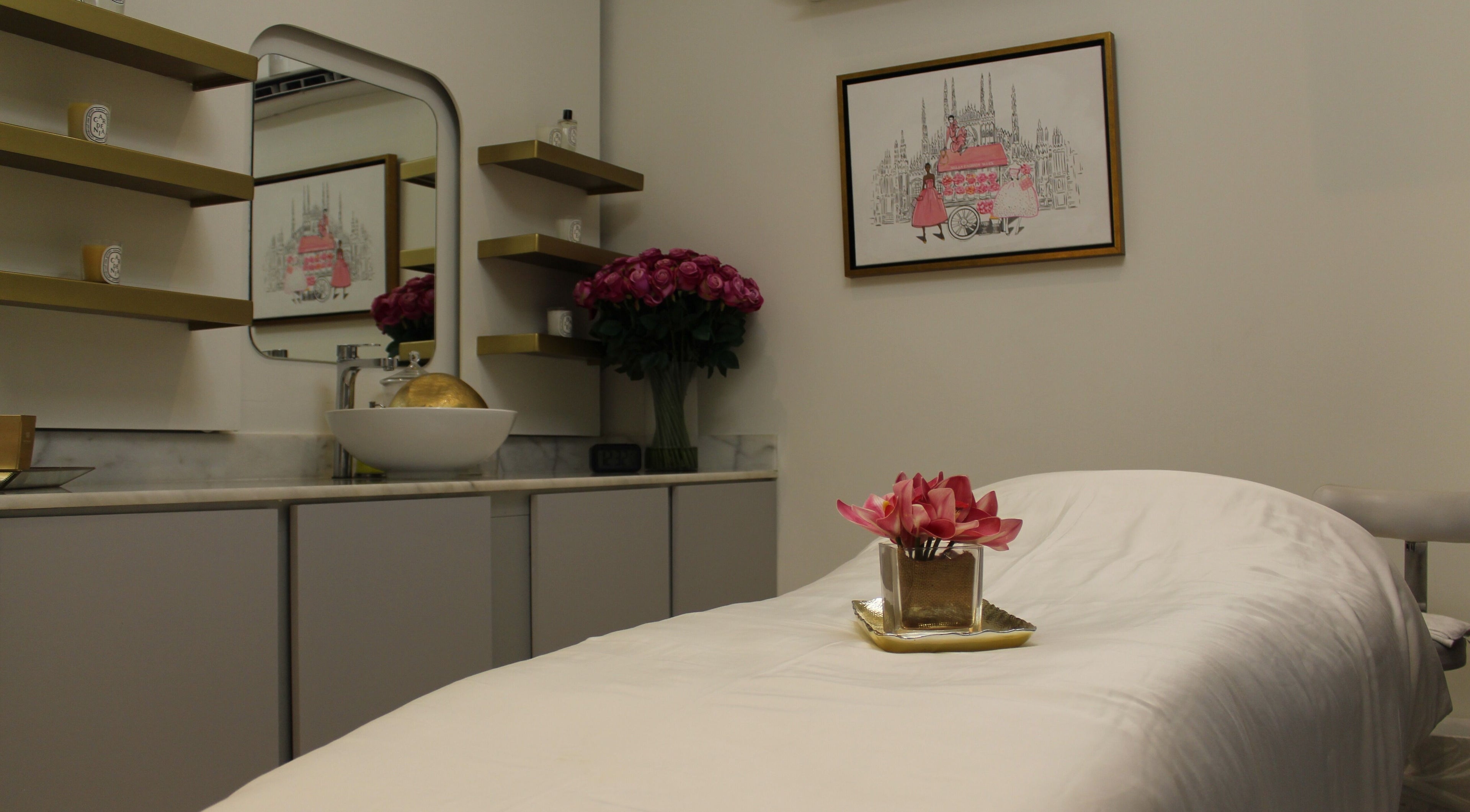 Cozy treatment room at Skin Glow Facial Center in Abu Dhabi, AE, featuring elegant decor and a plush massage bed.