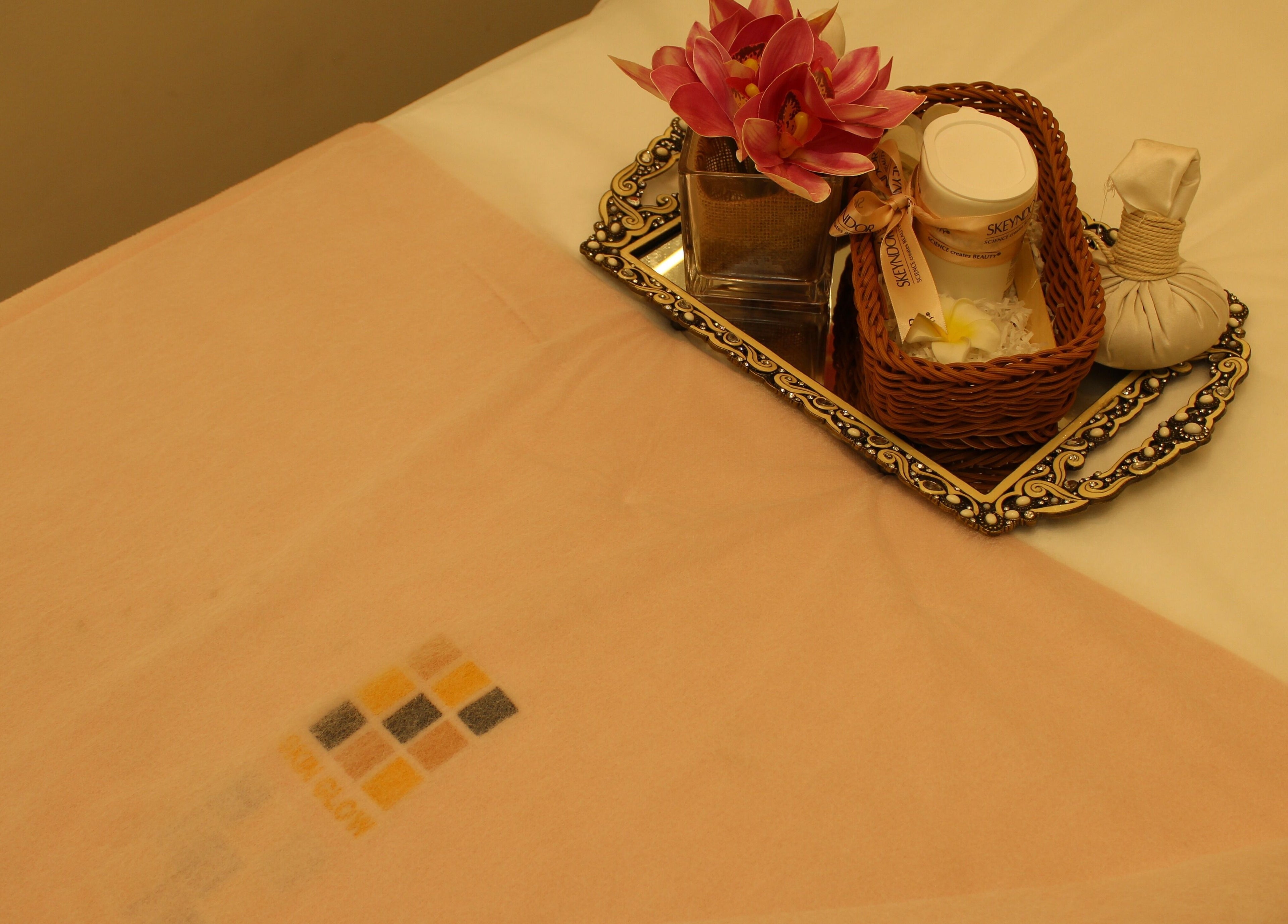 Luxurious spa setup with flowers at Skin Glow Facial Center, Abu Dhabi, AE, enhancing relaxation and rejuvenation.