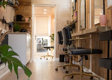 Warm, stylish salon chairs at Carley Bayne Hair, Epsom, England, GB showcasing a welcoming atmosphere.