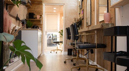 Warm, stylish salon chairs at Carley Bayne Hair, Epsom, England, GB showcasing a welcoming atmosphere.