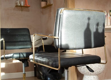 Chic hair salon chair at Carley Bayne Hair in Epsom, England, GB, highlighting modern and luxurious style.
