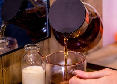 Relaxing tea pour at Carley Bayne Hair, Epsom, England, GB, offering tranquility and comfort to clients.