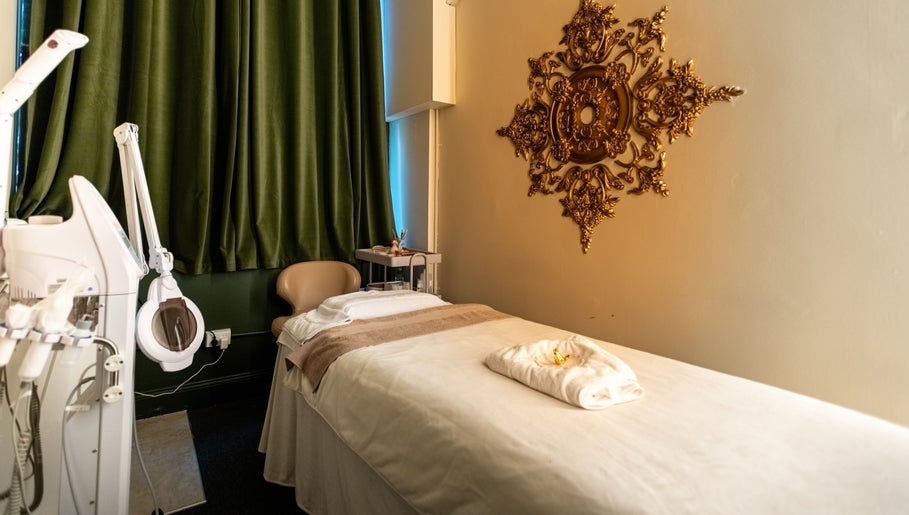Luxurious spa room at Timeless Style in Melbourne, Victoria, AU with ornate decor and plush treatment bed.