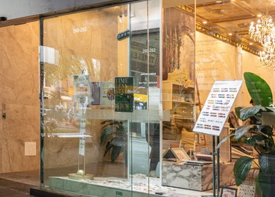Timeless Style salon exterior in Melbourne, Victoria, AU. Elegant glass entrance with chandelier view.