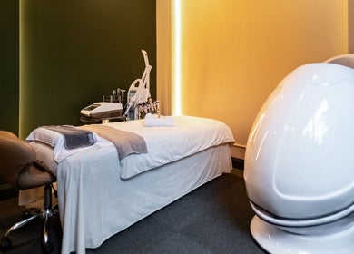 Relaxing spa room at Timeless Style, Melbourne, Victoria, AU, featuring a plush massage bed and wellness pod.