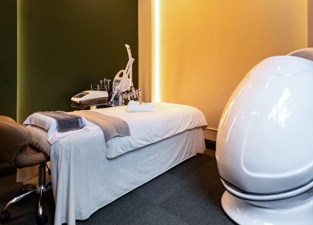 Modern treatment room at Timeless Style, Melbourne, Victoria, AU, featuring sleek massage bed and equipment.