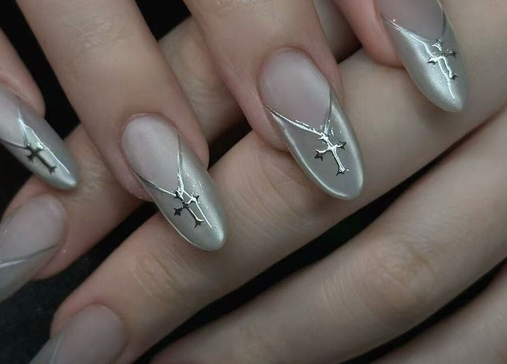 Elegant metallic nail art at Timeless Style, Melbourne, Victoria, AU, showcasing unique cross designs.