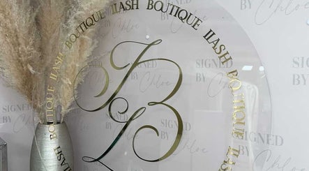 Sophisticated decor at ILashBoutiqúe, Wolverhampton, England, GB featuring pampas grass and branding.