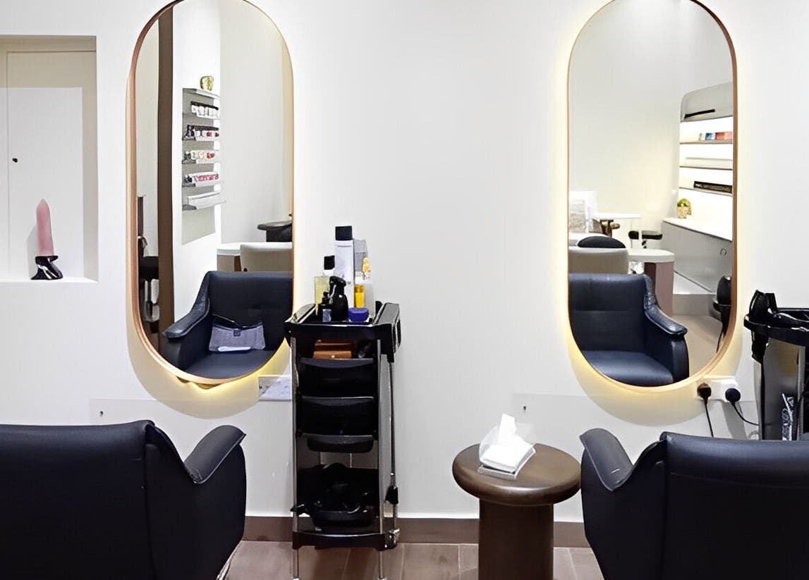 Modern salon chairs and mirrors in Maja Beauty Bar, Dubai, Dubai, AE, reflecting a chic and elegant ambiance.