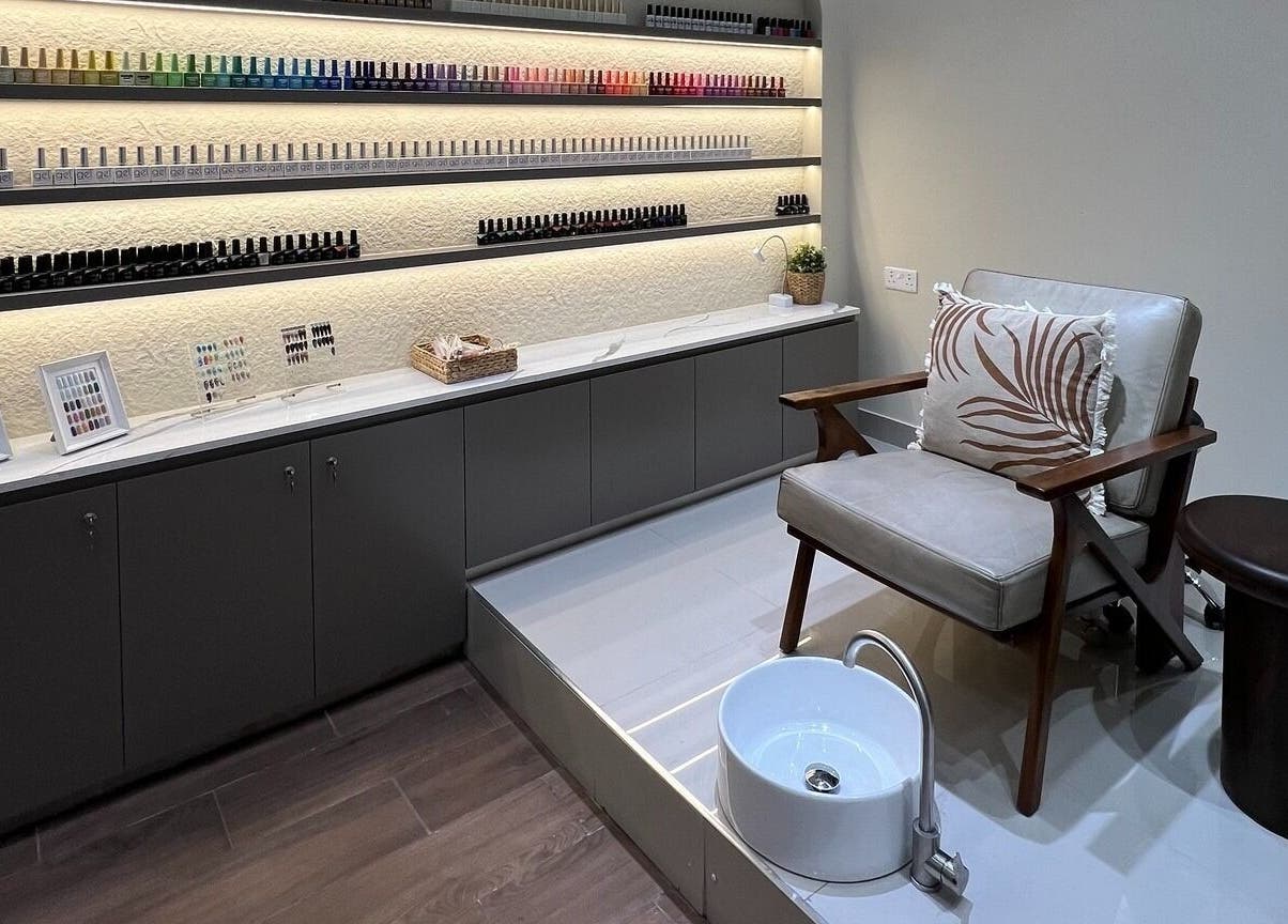 Elegant nail care area at Maja Beauty Bar, Dubai, Dubai, AE, with plush seating and extensive polish selection.