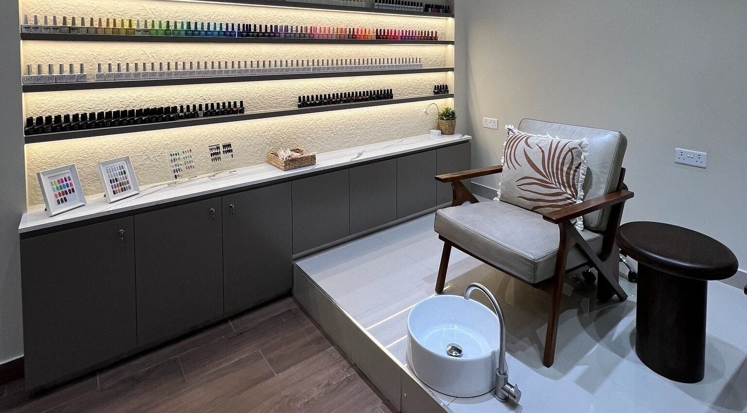 Elegant nail care area at Maja Beauty Bar, Dubai, Dubai, AE, with plush seating and extensive polish selection.