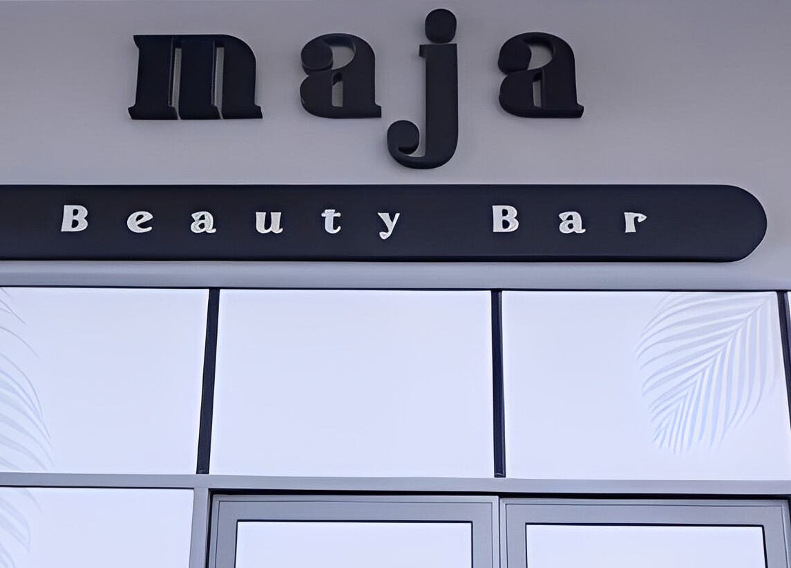 Exterior sign of Maja Beauty Bar in Dubai, Dubai, AE, showcasing its elegant logo.